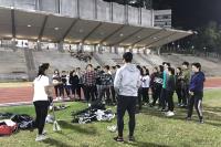 Participants learning valuable skills at lacrosse from the coach